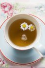 Cup of chamomile tea — Stock Photo