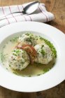 Clear broth with bacon dumplings — Stock Photo
