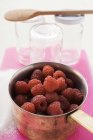 Fresh raspberries in pan — Stock Photo