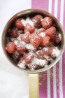 Sugared raspberries in saucepan — Stock Photo