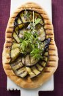 Grilled sliced aubergines on pizza — Stock Photo