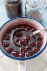 Cherry jam in pan — Stock Photo