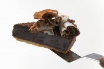 Chocolate tart on cake server — Stock Photo