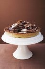 Chocolate tart on cake stand — Stock Photo