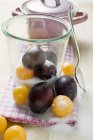 Black and mirabelle plums — Stock Photo