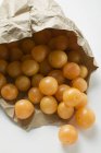 Mirabelles in a paper bag — Stock Photo