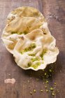 Poppadams with grated pistachios — Stock Photo