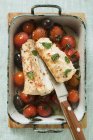 Monk-fish with cherry tomatoes and olives — Stock Photo