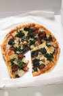 Spinach, tomato and pizza — Stock Photo