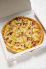 Hawaiian pizza and pineapple — Stock Photo