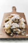 Stollen pieces on chopping board — Stock Photo