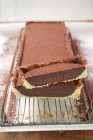 Partly sliced Rectangular chocolate tart — Stock Photo