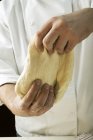 Man kneading pizza dough — Stock Photo
