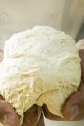 Kneading pizza dough — Stock Photo