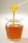 Honey drizzling off — Stock Photo