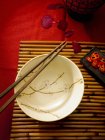 Asian table setting with bowl and chopsticks — Stock Photo