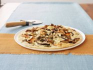 Potato pizza topped with mushrooms — Stock Photo