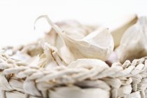 Small basket of garlic cloves — Stock Photo