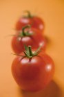 Three red tomatoes — Stock Photo