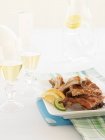Pork ribs with citrus fruits — Stock Photo
