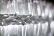 Closeup view of stemmed wine glasses in a row — Stock Photo