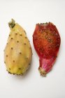 Whole and half prickly pears — Stock Photo