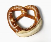 Soft pretzel on white background — Stock Photo