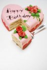 Pink heart-shaped birthday cake — Stock Photo
