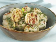 Potato dumplings with bacon — Stock Photo