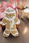 Gingerbread man on wooden surface — Stock Photo