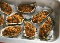 Oysters au gratin with herbs — Stock Photo