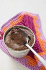 Closeup view of chocolate souffle filled with chocolate sauce — Stock Photo