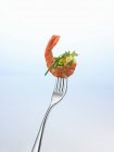 Closeup view of prawn and herbs on fork — Stock Photo