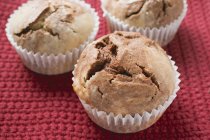 Chocolate and vanilla muffins in paper cases — Stock Photo