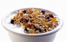 Muesli with dried fruits and milk — Stock Photo