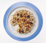 Muesli with dried fruits and milk — Stock Photo