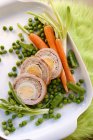 Turkey roulade with egg on white plate — Stock Photo