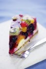 Closeup view of fruit Gateau piece with fork on plate — Stock Photo