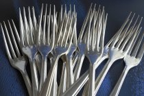 Closeup view of metal forks in heap — Stock Photo