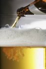Beer being poured — Stock Photo