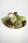 Salad leaves with cucumber — Stock Photo
