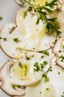 Closeup view of Cep mushroom Carpaccio with olive oil and herbs — Stock Photo