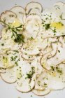 Top view of Cep mushroom Carpaccio with olive oil and herbs — Stock Photo