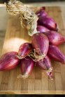String of red onions — Stock Photo