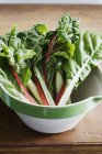 Fresh chard leaves in bowl — Stock Photo