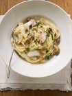 Tagliatelle pasta with ceps and sauce — Stock Photo