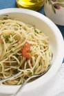 Spaghetti with chillies and herbs — Stock Photo