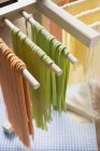 Homemade pasta hanging for drying — Stock Photo
