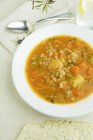 Bowl of Tuscan White Bean Stew on white plate — Stock Photo