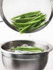 Blanched beans in sieve — Stock Photo